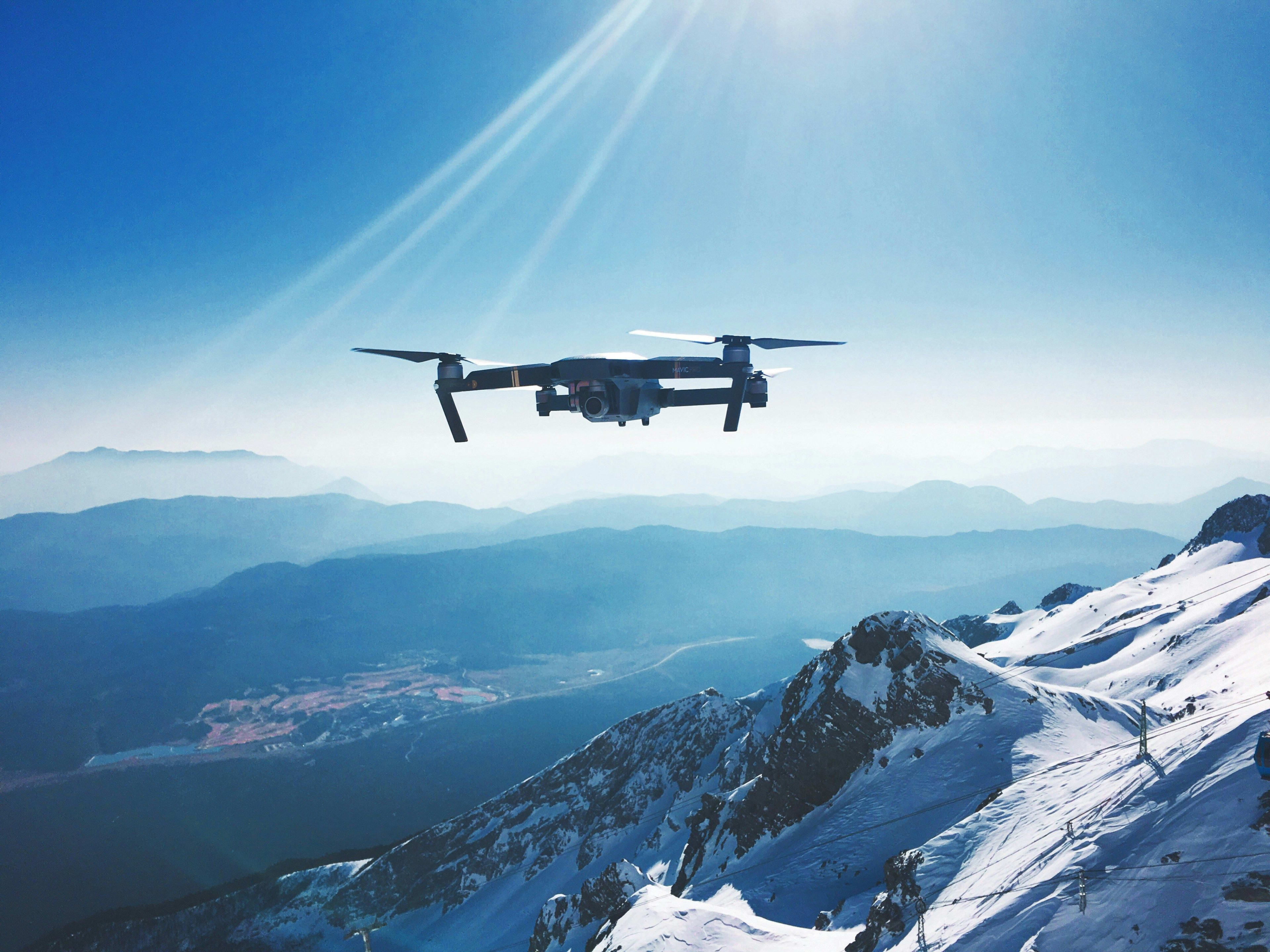 drone flying over glacier